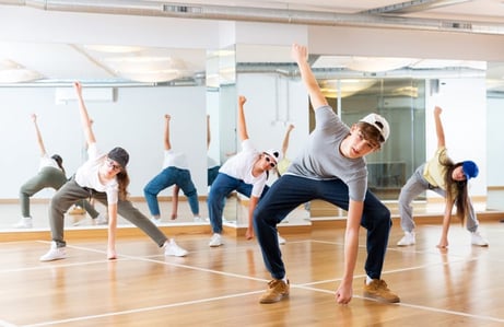 Student leading others in dance