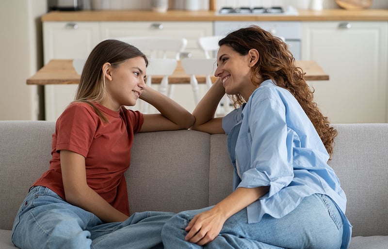 Parent talking with child about how the school year went