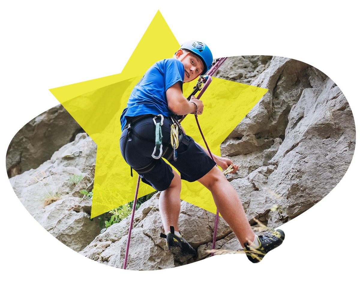 Student rocking climbing while on an Adventure