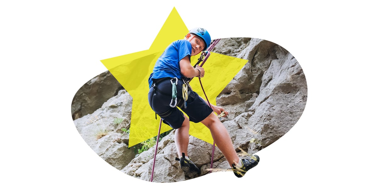 High schooler rock climbing