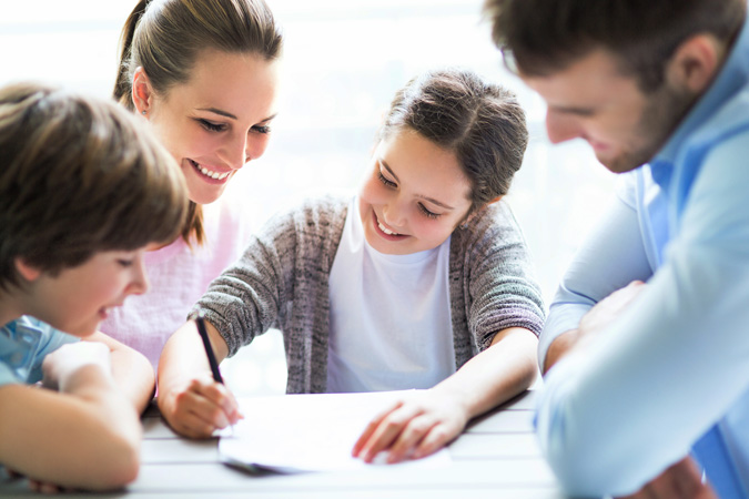 Family happily working together from home